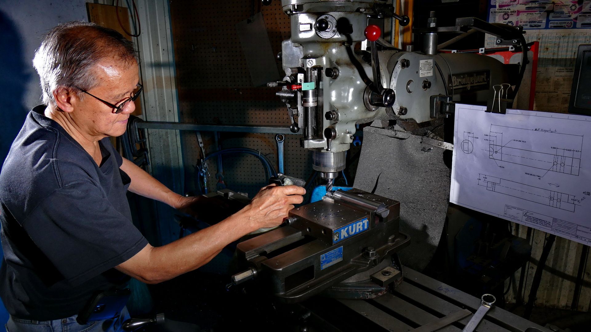 Senior Man Working On Machine